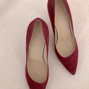 Red suede dress shoes.